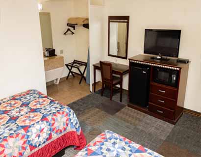 King bed at Whispering Palms Inn